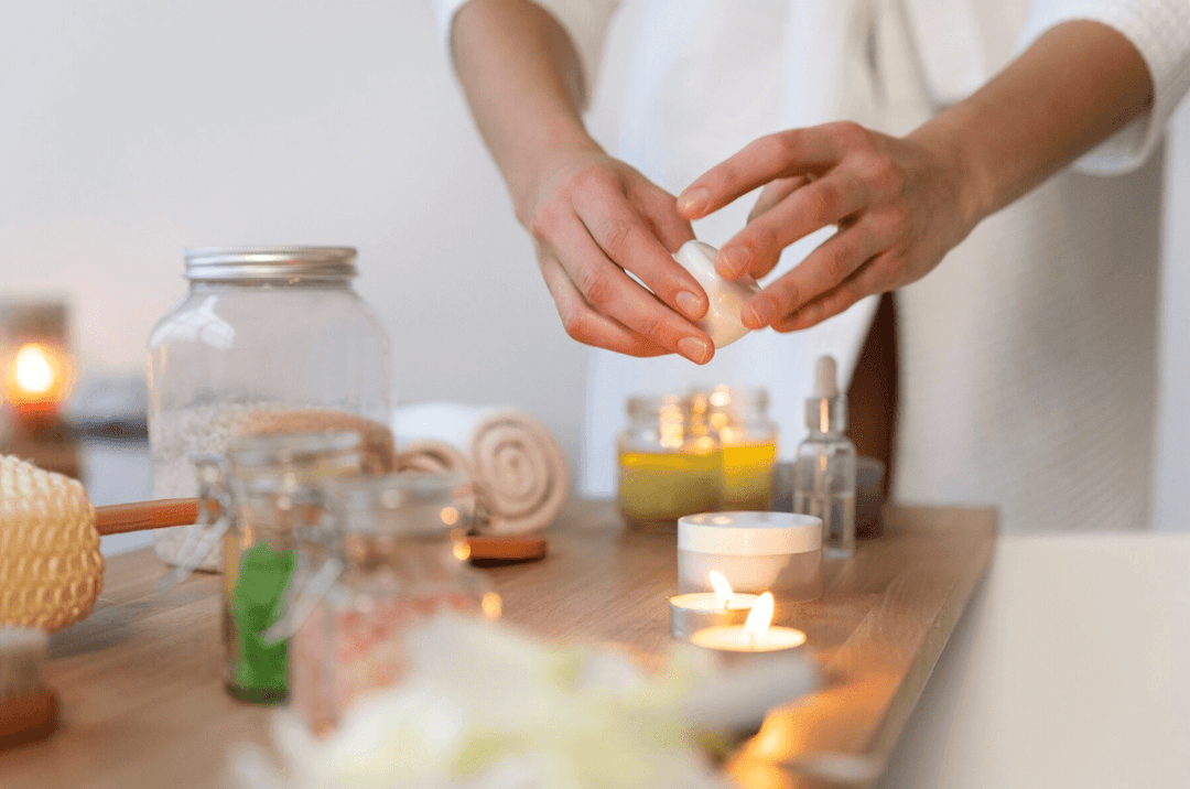 Two hands trying to light a candle