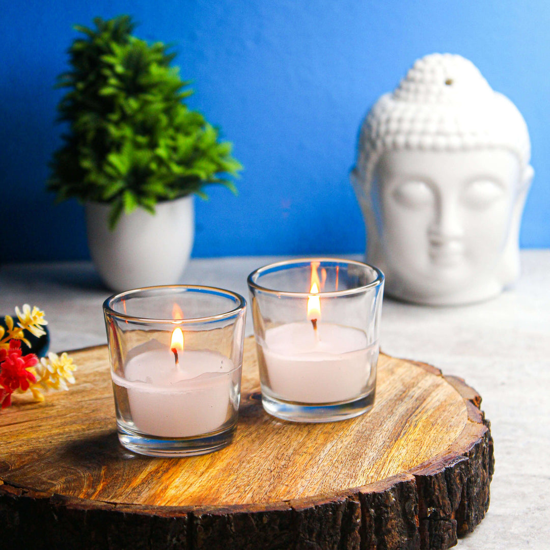 Burning Candles on Wooden Tray beside Head of Buddha