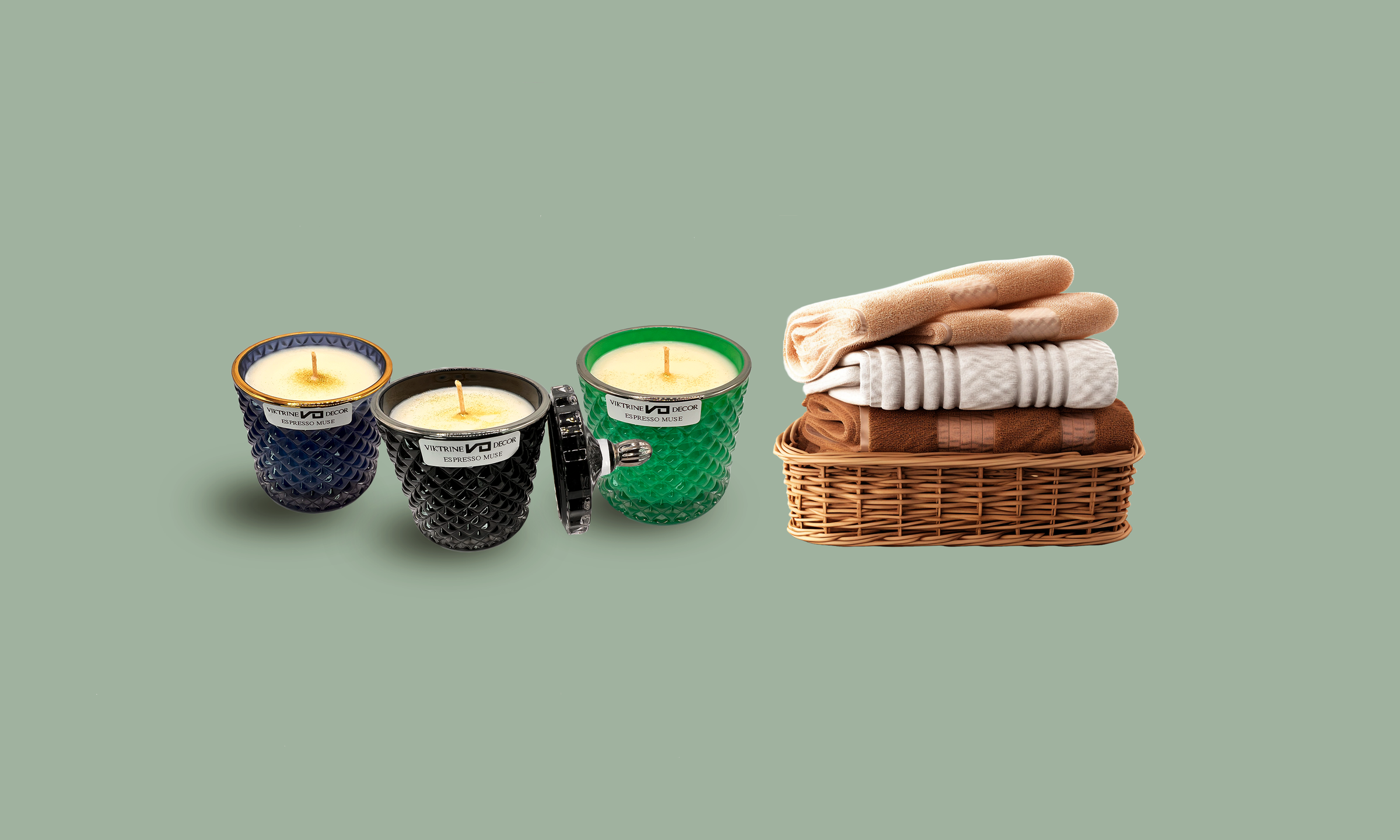 Three candle jars placed near a basket filled with towels